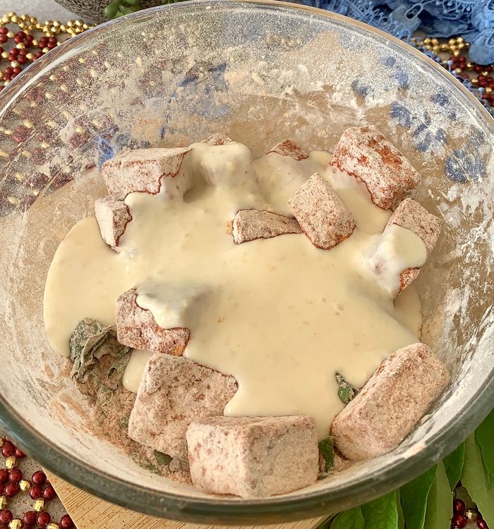 Step 1.1: Pour this curd mixture into the bowl of paneer, mixing well to coat the paneer cubes evenly