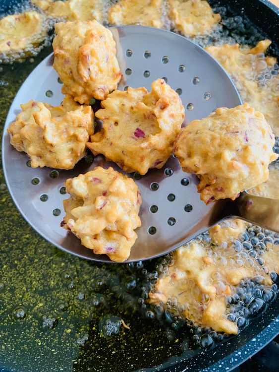 Step 2.1: Take small portions of the batter, and carefully drop them into the hot oil
