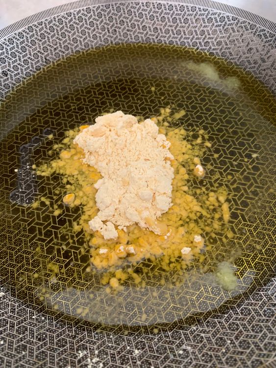 Step 1.1: Add gram flour and roast it, stirring continuously, until it turns golden brown and releases a nutty aroma