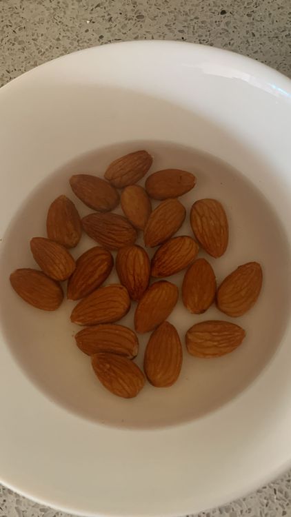 Step 1.1: Soak the almonds in hot water for 30 minutes, then peel off the skin, make a paste using a blender, and set the almond paste aside
