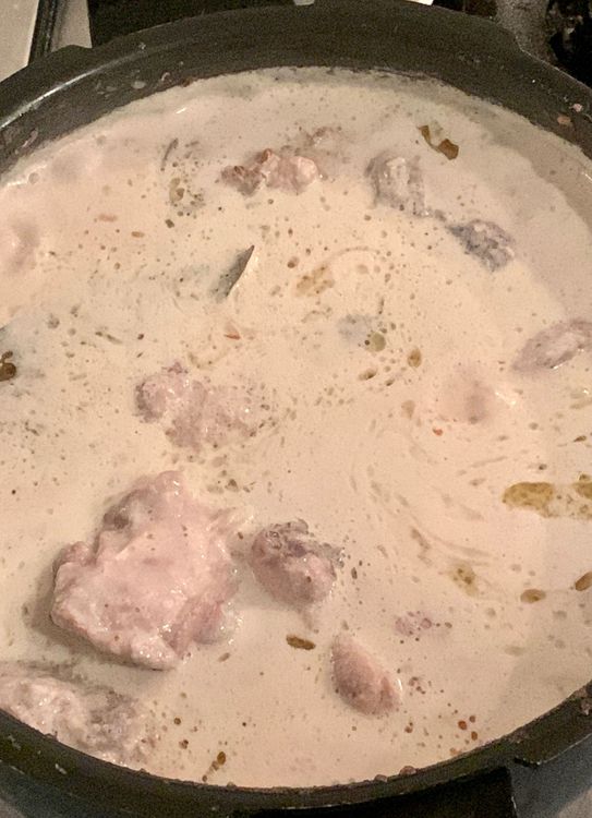 Step 1.1: Reduce the heat to simmer and cover the wok