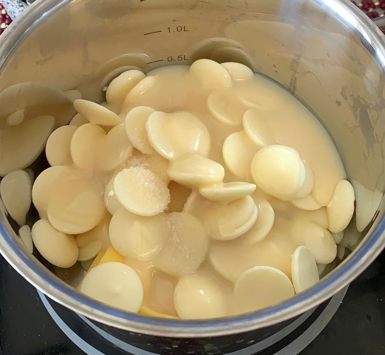 Step 1.1: In a medium-sized saucepan, combine the sweetened condensed milk, white chocolate chips, unsalted butter and rock salt