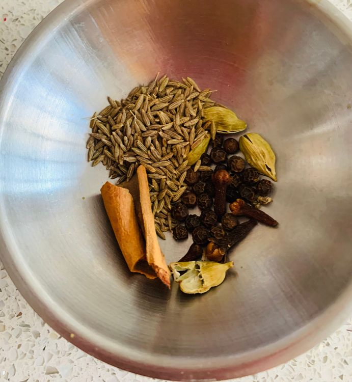 Step 3.1: Add green cardamoms, cinnamon, cumin, black peppercorns, and cloves