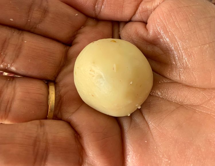Step 1.1: Once the mixture is chilled and slightly hardened, use your hands to roll small portions into bite-sized balls