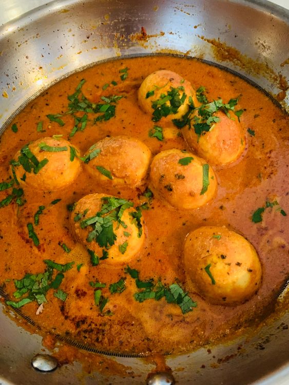 Step 3.1: Garnish with fresh coriander leaves and drizzle ghee over the curry before serving