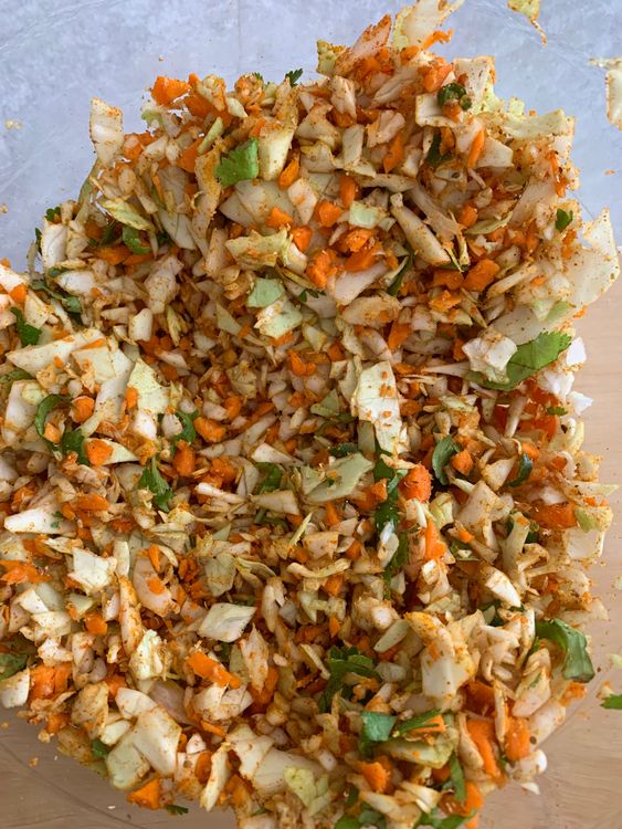Step 1.1: In a mixing bowl, combine the chopped vegetables, green chillies, fresh coriander, salt, cumin powder, chaat masala, coriander powder, turmeric powder, red chilli powder, and carom seeds