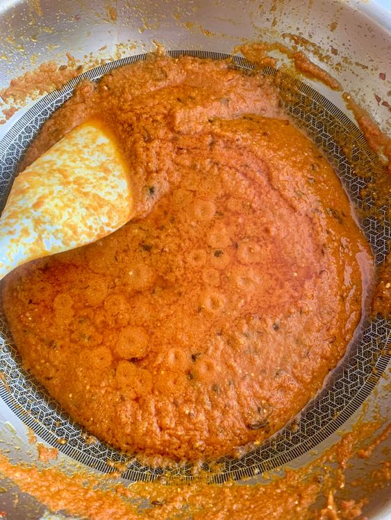 Step 2.2: Add ground tomatoes and curd while stirring continuously