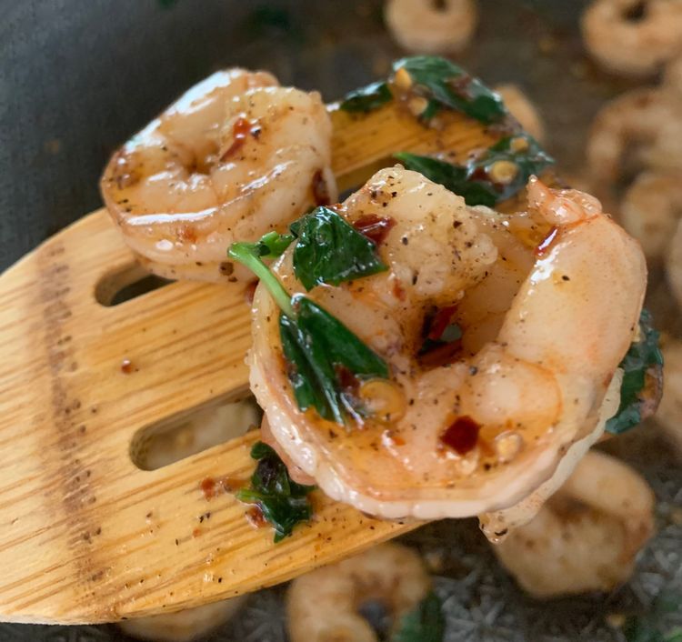 Step 1.2: Add the basil leaves and stir for a minute
