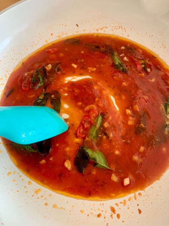 Step 4.1: Pour in ½ cup water and bring the sauce to a gentle boil, stirring continuously