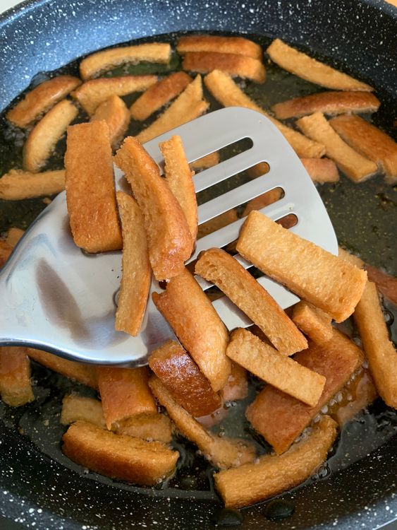 Step 1.1: Fry the bread pieces until golden brown and crisp