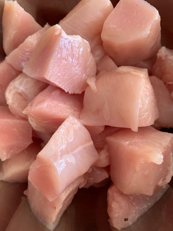 Step 1.1: In a bowl, combine chicken cubes with soy sauce, cornstarch, black pepper powder, chilli flakes, and olive oil