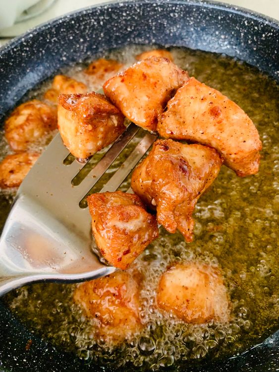 Step 1.1: Heat oil in a pan and deep-fry or shallow-fry the marinated chicken until golden brown and fully cooked
