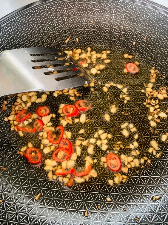 Step 3.1: Heat olive oil in a large wok or pan