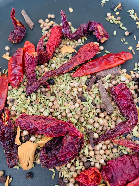 Step 1.1: Dry roast the Kashmiri red chillies, dry red chillies, coriander seeds, cumin seeds, fennel seeds, black peppercorns, cloves and cinnamon stick until fragrant over low-medium heat