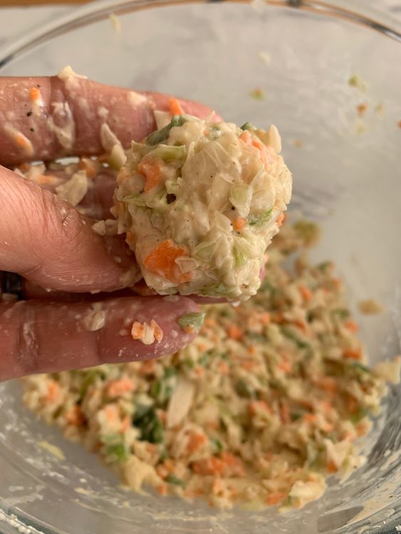 Step 1.1: Grease your palms with oil and shape the mixture into small balls, pressing firmly to bind