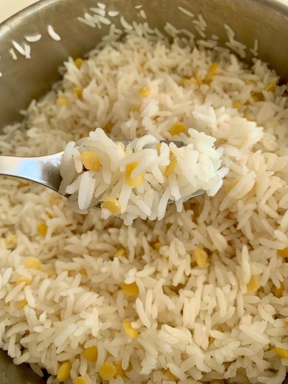Step 2.1: Add the rinsed rice and toor dal to the boiling water and cook for 7-8 minutes until tender yet slightly firm