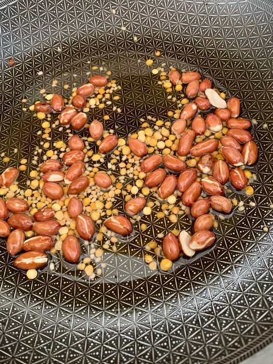 Step 3.1: Add peanuts, urad dal, toor dal, and chana dal