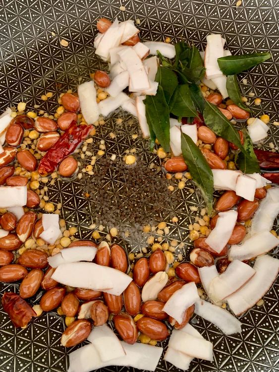 Step 3.1: Add mustard seeds, dry red chillies, sliced coconut, and curry leaves