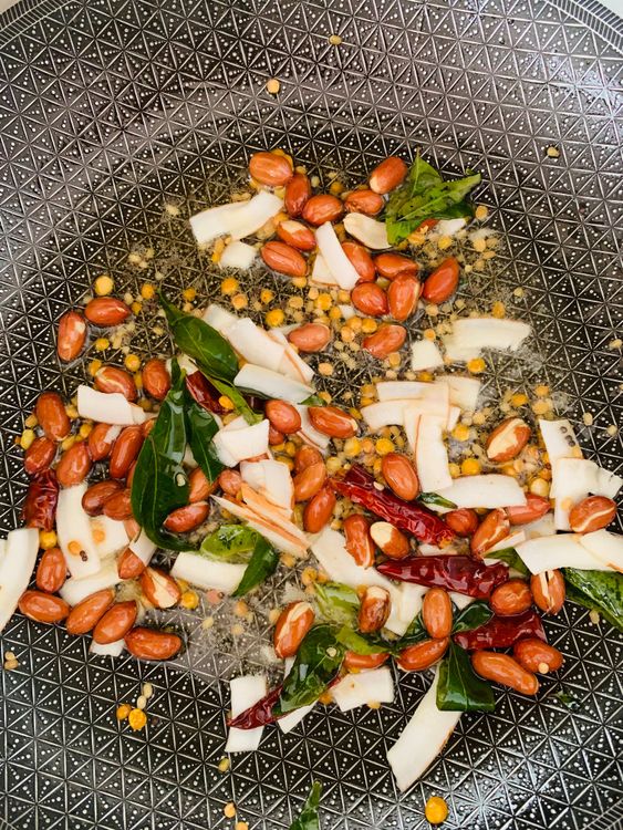 Step 3.2: Add mustard seeds, dry red chillies, sliced coconut, and curry leaves