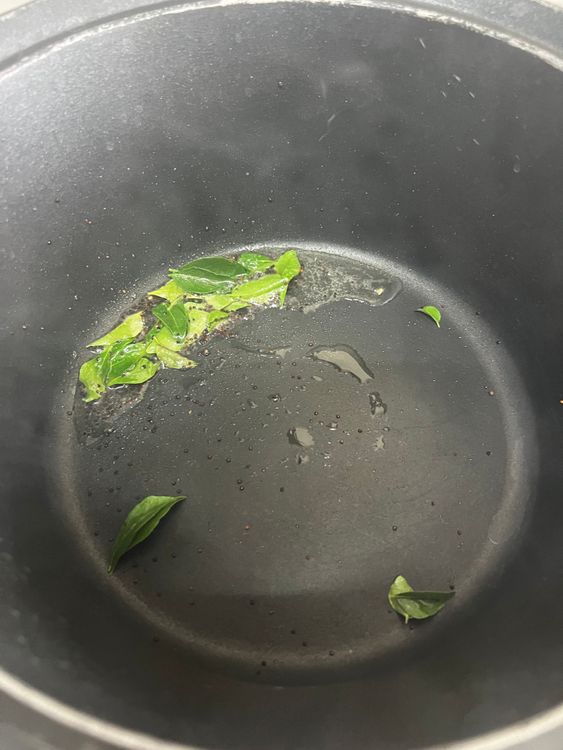 Step 2.1: In a deep pan, add oil followed by mustard seeds and curry leaves