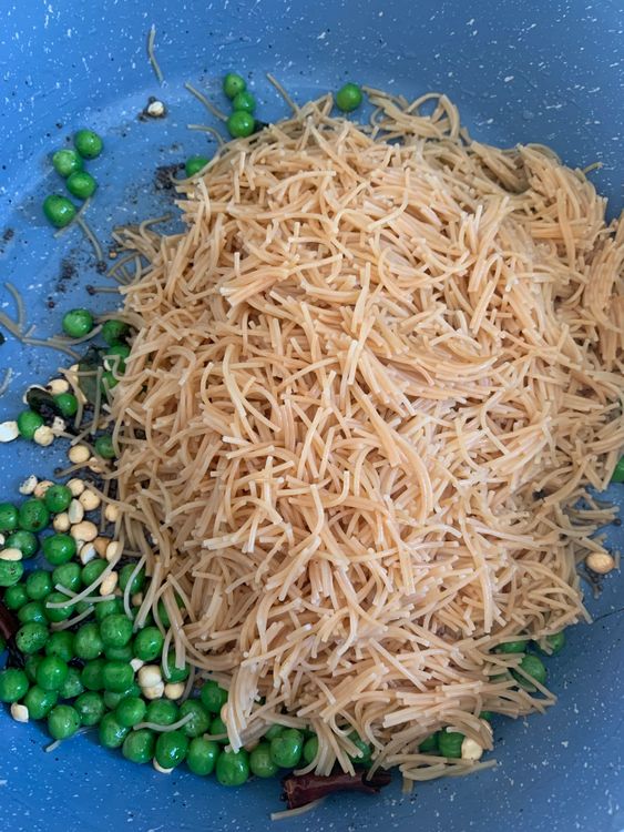 Step 3.1: Add the boiled vermicelli and sauté over medium-high heat