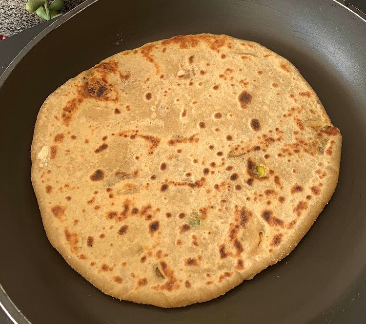 Step 2.2: Cook the stuffed paratha for 1-2 minutes on each side
