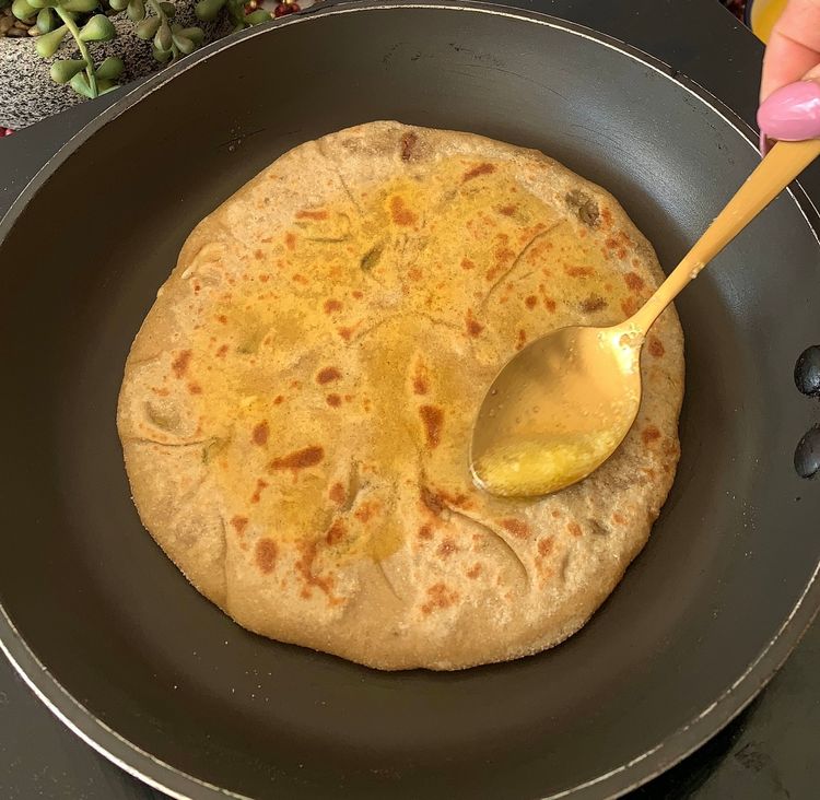 Step 2.1: Apply ghee on each side and cook until golden brown and crisp