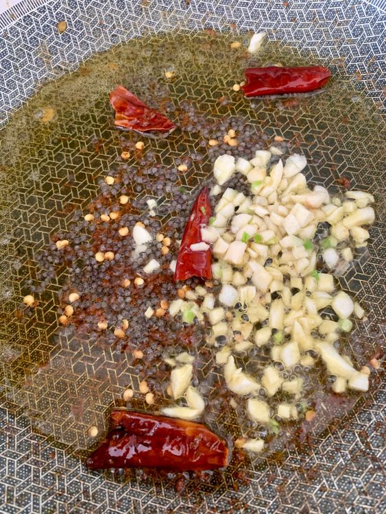 Step 2.1: Add garlic, saute until fragrant, then add onions