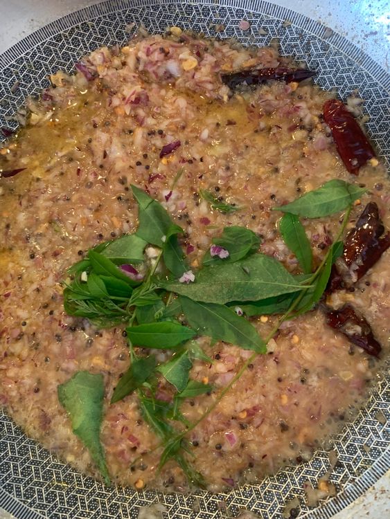 Step 2.2: Add garlic, saute until fragrant, then add onions