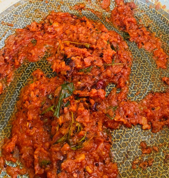 Step 2.1: Mix in kashmiri red chilli powder, tomato, salt, turmeric, coriander powder, cumin powder, and grated coconut