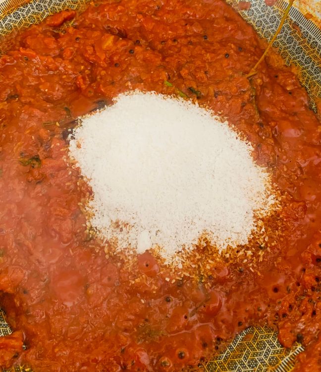 Step 2.3: Mix in kashmiri red chilli powder, tomato, salt, turmeric, coriander powder, cumin powder, and grated coconut