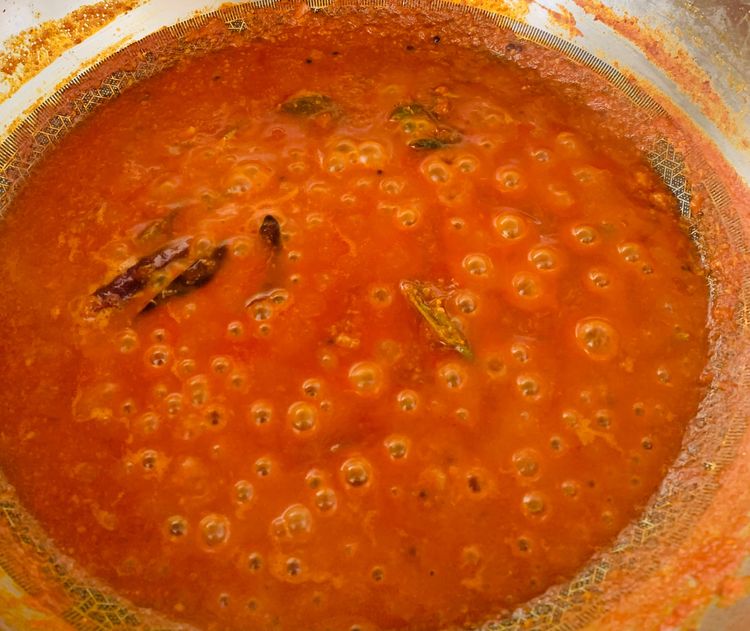 Step 2.2: Add water, bring it to a boil, cover, and simmer for 4-5 minutes on medium heat until oil starts to ooze to the sides