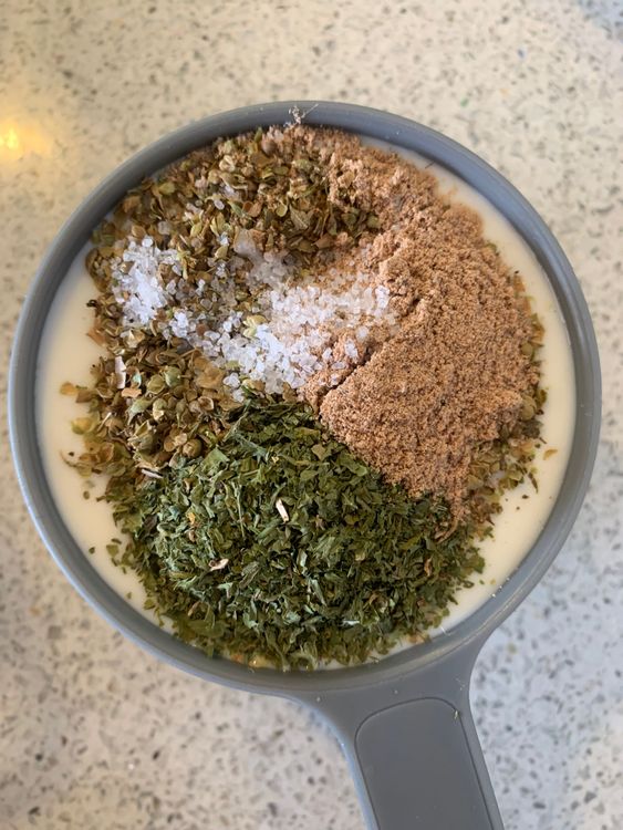 Step 1.1: Combine milk with oregano, parsley, nutmeg powder, salt and black pepper powder