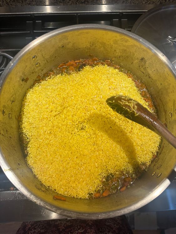 Step 4.1: Add the toasted rice to the chicken gravy in the main pot