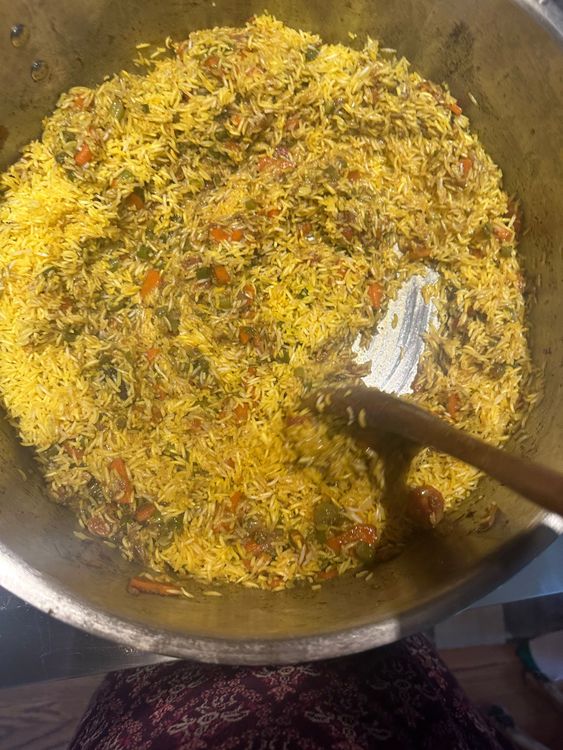 Step 4.2: Add the toasted rice to the chicken gravy in the main pot