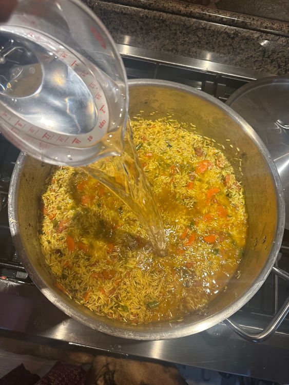 Step 4.1: Pour in 6 cups of water, add salt and stir gently