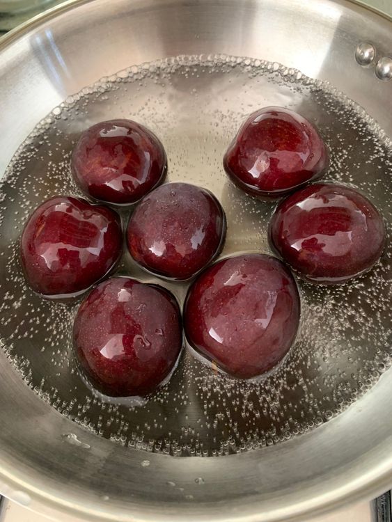 Step 1.1: Add plums and water to a deep pan