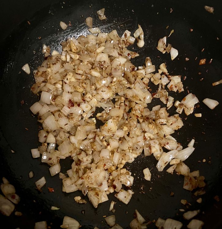Step 1.2: Add your onions, garlic, and ginger and stir for three minutes, or until the onions become slightly translucent