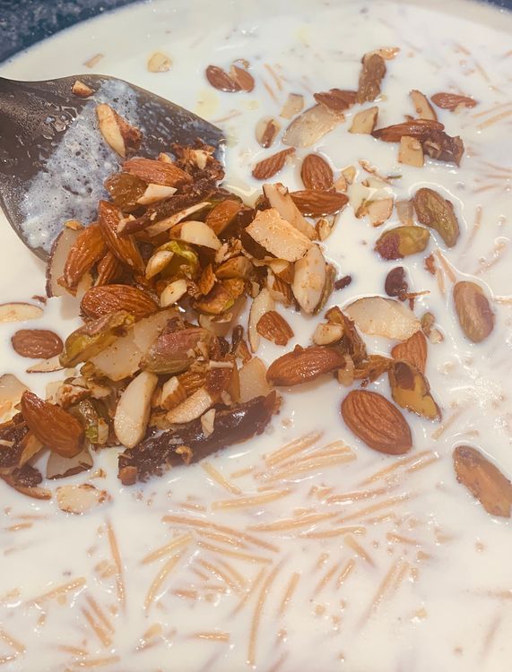 Step 1.5: Add sugar, cardamom powder, fried dates, almonds, pistachios, dry coconut, and raisins
