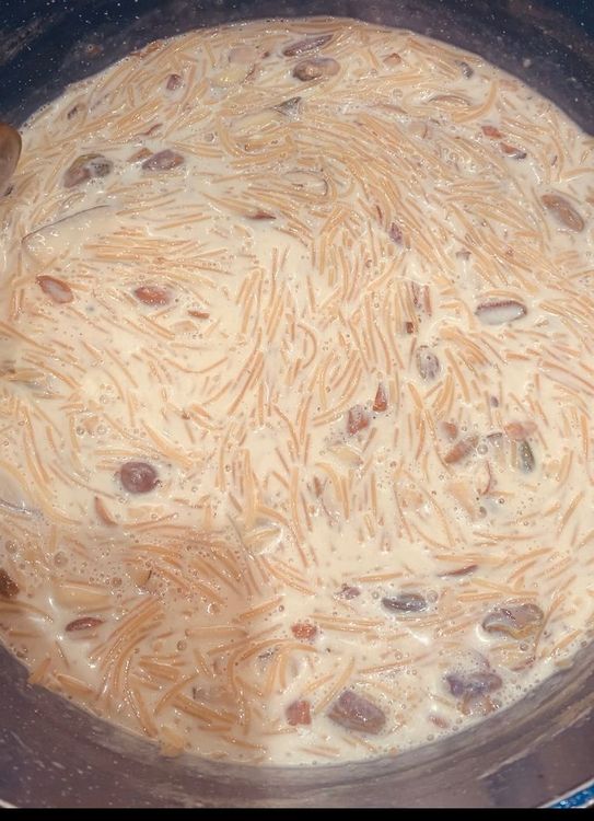 Step 1.1: Check the consistency of the Sheer Khurma and adjust as necessary by adding more milk or simmering longer to reduce the liquid to achieve the desired consistency