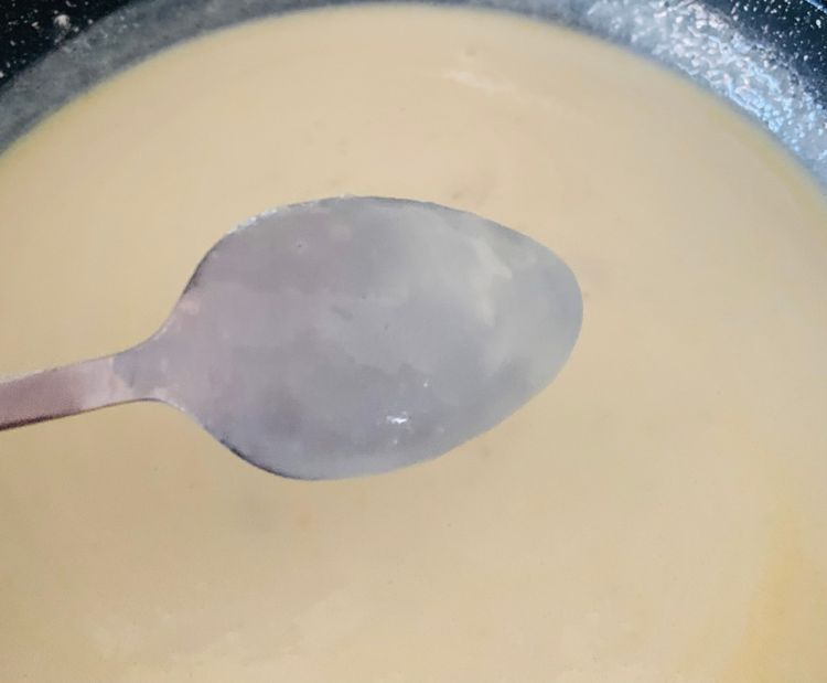 Step 2.2: Slowly add the warm milk while whisking continuously to avoid lumps