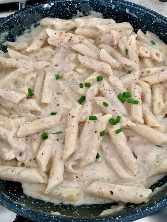 Step 4.1: Serve your creamy white sauce pasta hot, garnished with extra cheese or freshly chopped spring onions for a little crunch and freshness