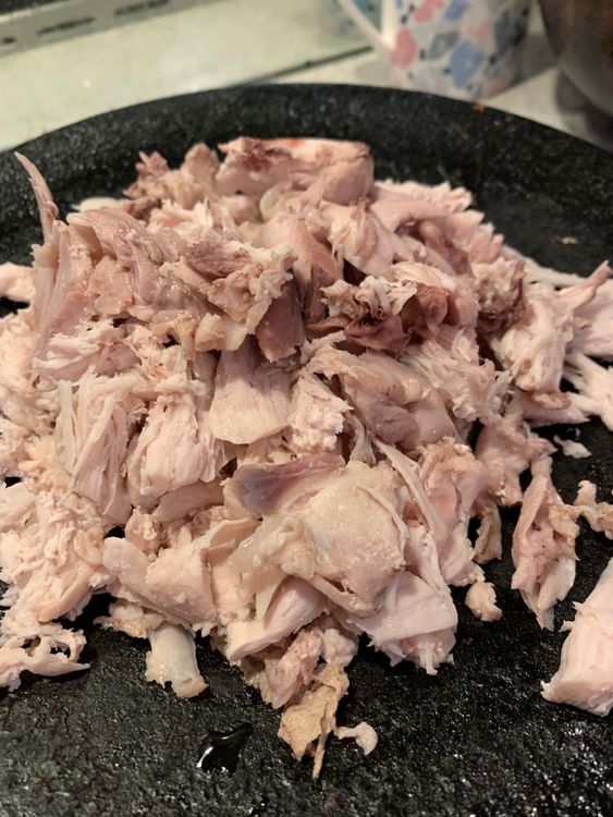 Step 1.1: Remove the chicken from the pot, allow it to cool, and then shred it into small pieces