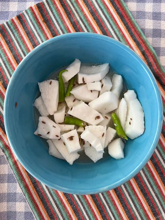 Step 2.1: Grind the chopped coconut, green chilies, and cumin seeds into a coarse paste with a little water in a mixture grinder