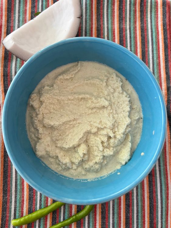 Step 2.2: Grind the chopped coconut, green chilies, and cumin seeds into a coarse paste with a little water in a mixture grinder