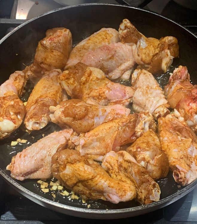 Step 1.1: Place the marinated wings in the pan and cook for 15-20 minutes