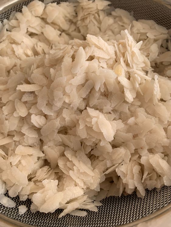 Step 1.1: Rinse the poha in a strainer under running water