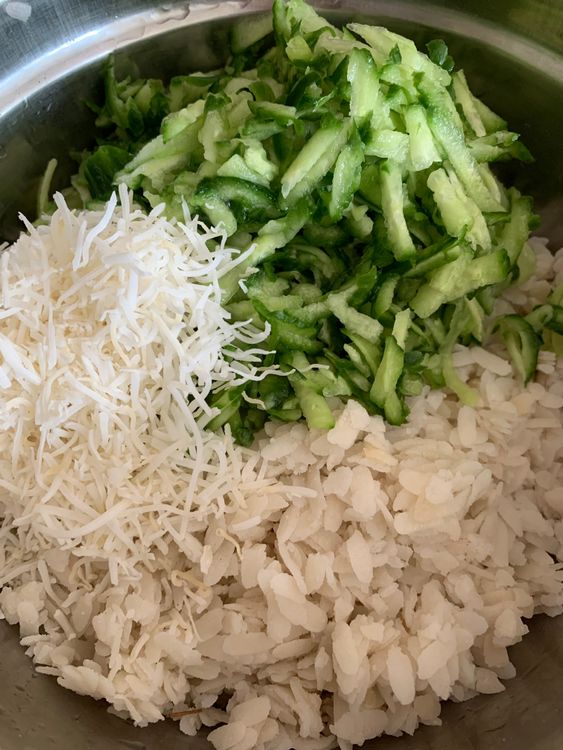 Step 1.2: In a large mixing bowl, add the softened poha, grated cucumber, and grated coconut