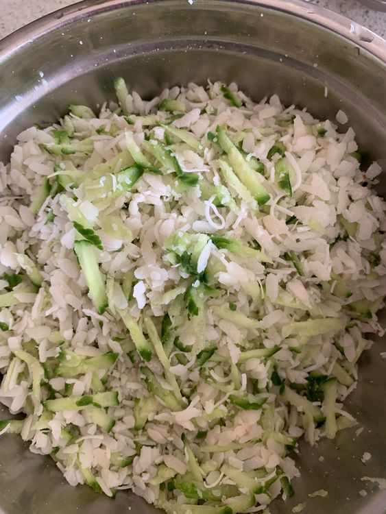 Step 1.3: In a large mixing bowl, add the softened poha, grated cucumber, and grated coconut