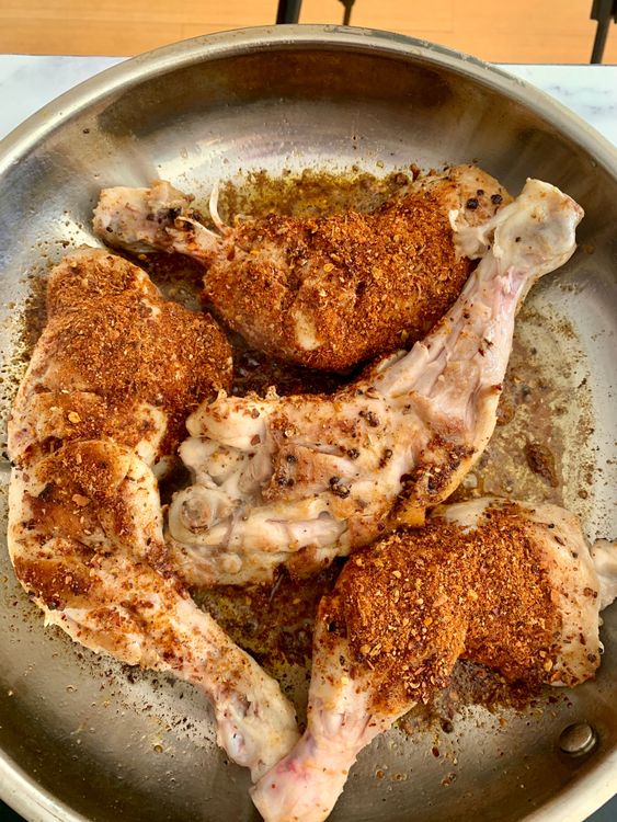 Step 3.1: Add the prepared masala powder and toss to coat the chicken evenly